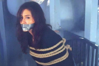 The tied-up and gagged Fujisaki Toko moment after being slapped by her captive