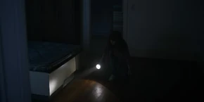 Joyce crouching down to the floor.