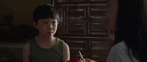 A seven-year-old Shang-Chi listening to his mother's story on how she met his father.