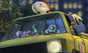 Buzz riding a Pizza Planet truck with Potato Head, Hamm, Rex and Slinky in Toy Story 2