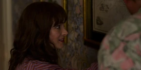 Joyce examining the map, pinpointing where Starcourt bought properties in East Hawkins.