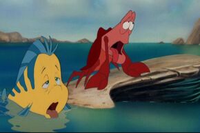 Flounder and Sebastian outta breath after they arrive at a beach coast.