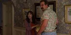 Joyce and Hopper hearing a noise, realizing the mayor is trying to escape.