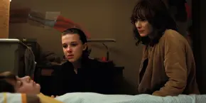 Joyce and El observing a sleeping Will.