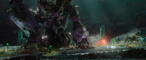 Trion removing the T-cogs from the Prime's corpses.