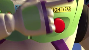 Buzz pushes the red circle button to pop his wings out.
