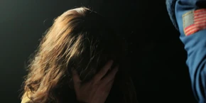 Joyce facepalming in despair as Will starts acting aggressive.