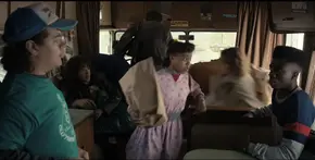 Lucas, Dustin, and Eddie seeing the others enter the RV in a hurry due to encountering Jason and his basketball team.