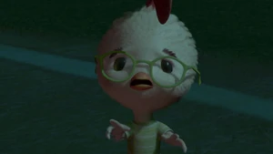 Chicken Little looks at his father who refuse believe him about the alien spaceship.