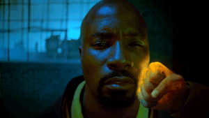 Iron Fist punches Luke Cage
