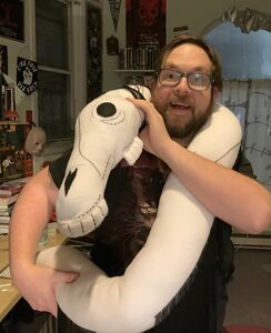 Trevor with a Long Horse plush made by his partner.