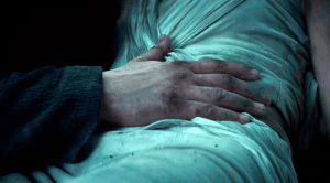 Rey holds Ben's hand