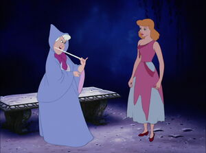 Cinderella with her Fairy Godmother as the latter tries to figure out what she needs in order to go to the ball.