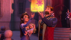 Rapunzel with her parents as they light a floating lantern to celebrate her birth.