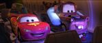 McQueen and Mater laughing as they watch TV together.