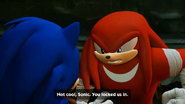 Knuckles staring down to Sonic