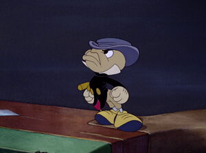 Jiminy Cricket putting his foot down after discovering that Pinocchio is friends with rude boy Lampwick.