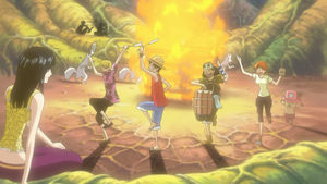 Straw Hats dancing around the camp fire