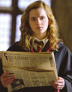 Holding the newspaper in year 6