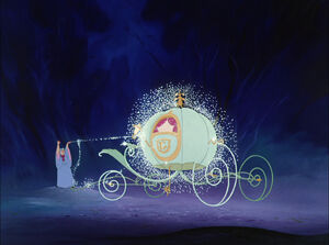 The Fairy Godmother turns the pumpkin into a beautiful carriage.