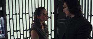 Rey tries to convince Kylo that he will change sides.