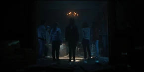 Everyone watching the chandelier's lights go out.