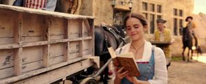 Belle reading a book.