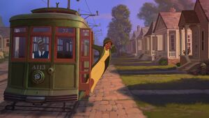 Tiana catching a ride on a trolley.