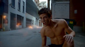 From the 2014 TV show The Flash, Barry Allen narrowly escapes after Plastique blows up his Flash suit