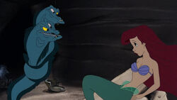 Ariel listening to Flotsam and Jetsam tell her there's a way for her dreams to come true.