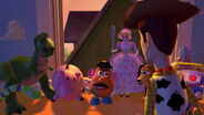 Mr. Potato Head, Hamm, and the other toys rebelling against Woody, accusing him of pushing Buzz out the window on purpose.