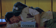 Cookie Monster trying to the cookies from Sid.