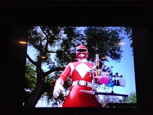 Red Ranger is holding a flasks of liquid