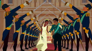 Tiana and Naveen exiting out of the church after getting married.