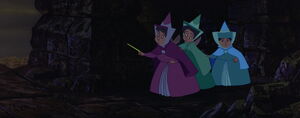 The three fairies trying to seek into Maleficent's castle.