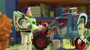 Buzz shaking hands with a robot named Sparks.