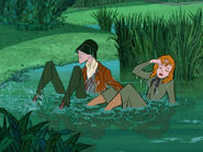 Anita and Roger having fallen into a pond.