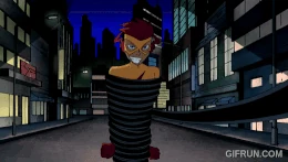 Kid Flash using his speed to break Madame Rouge's hold.