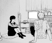 Denji and Asa watching movies inside Denji's apartment