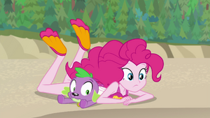 Pinkie Pie on top of Spike on the sand EGFF