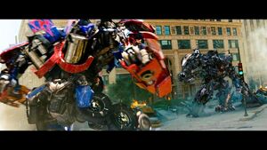 Optimus Prime facing and about to kill Shockwave.