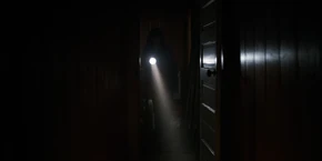 Joyce investigating a room in the farmhouse.