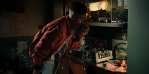 Lucas contacting Dustin through the radio.