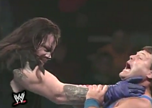 Jerry Lawler is attacked by Undertaker's choke