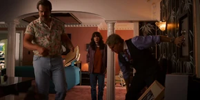 In the mayor's bedroom, Joyce watches Hopper being given some documents by Kline.