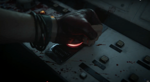Maya presses the red button to free The Heads of Requiem by opening the cell doors.