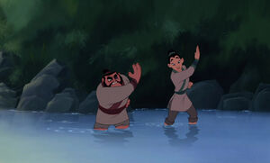 Mulan and Yao trying to catch fish with their hands.