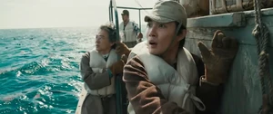 Shikishima and the Shinseimaru crew watching as Godzilla emerges from the water