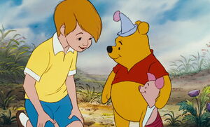 Christopher Robin with Pooh and Piglet