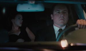 Natasha changing as Happy Hogan drives.